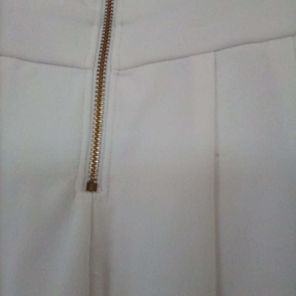 White sleeveless jumper by Express